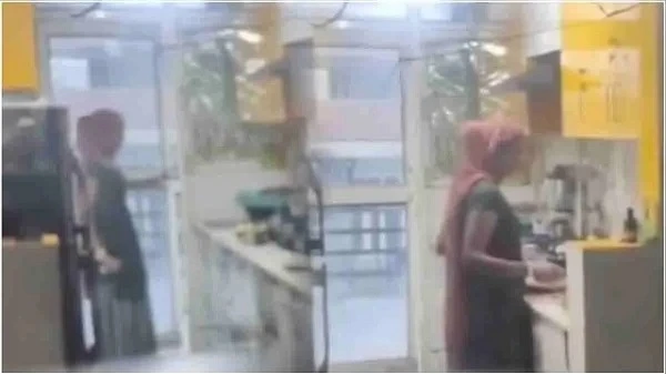 CCTV footage reveals Ghaziabad maid mixing urine in food, leading to her arrest after 8 years of working for the family.
