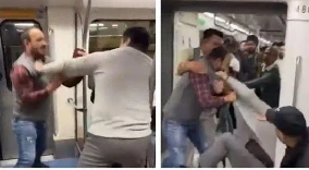Viral VIDEO: दिल्ली मेट्रो में यात्रा के दौरान धक्का-मुक्की के कारण दो यात्रियों के बीच जमकर मारपीट हो गई। इस घटना का वीडियो सोशल