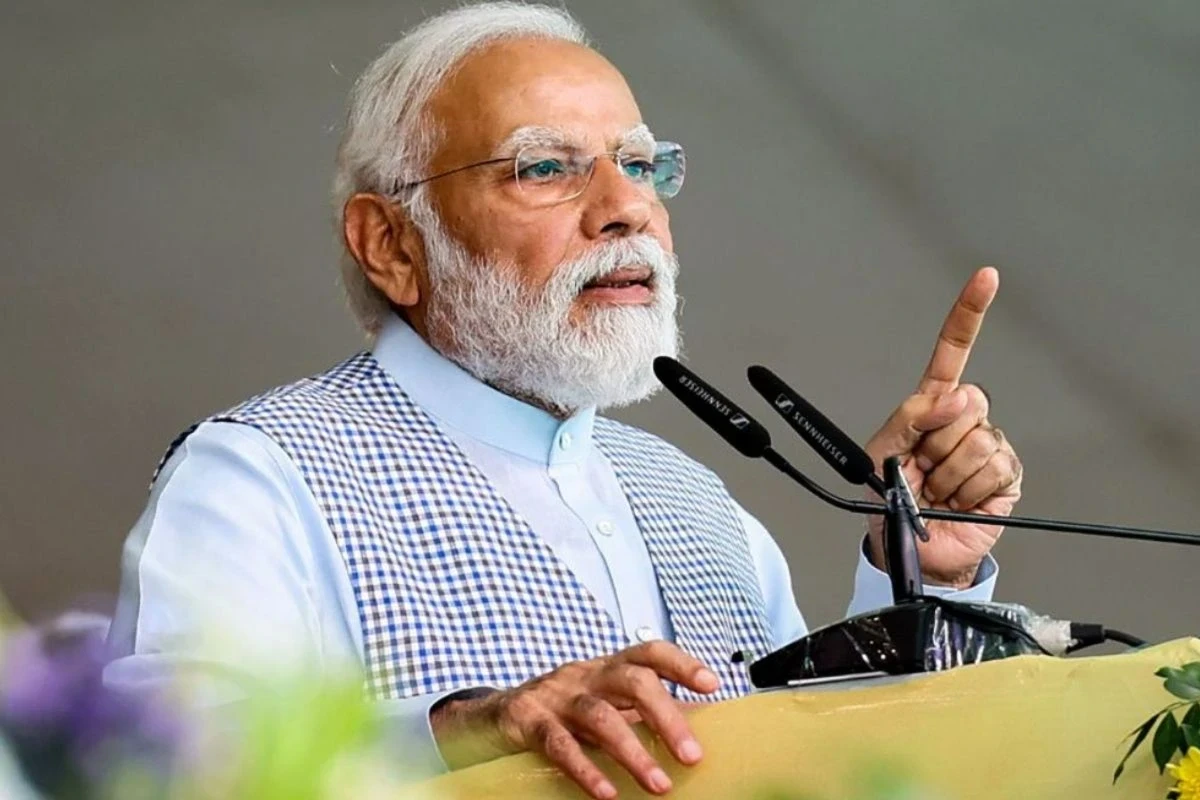 PM Modi hands over keys to beneficiaries of Swabhiman Apartments as part of the JJ Cluster rehabilitation project in Ashok Vihar, Delhi.