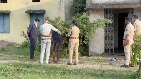 Police investigating the scene where the body of 13-year-old Chinmay Suryavanshi was found in a ruined school in Bilaspur.