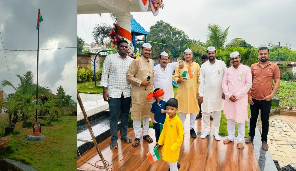 Residents of Govinda Green Residential Co-operative Society in Raipur raising the national flag during the 79th Independence Day celebration.