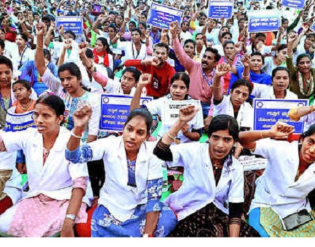 NHM contract employees in Madhya Pradesh protest in Bhopal demanding the enforcement of the 2023 contract policy. Vijay Thakkar announces a state-level memorial and protest on July 22 to honor deceased colleagues and push for policy implementation.