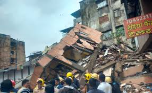 Rescue operation at the site of a collapsed three-storey building in Navi Mumbai's Shahbaz village on July 27, involving NDRF and local emergency services.